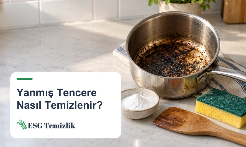 Dibi yanmış çelik tencere, karbonat ve tahta spatula